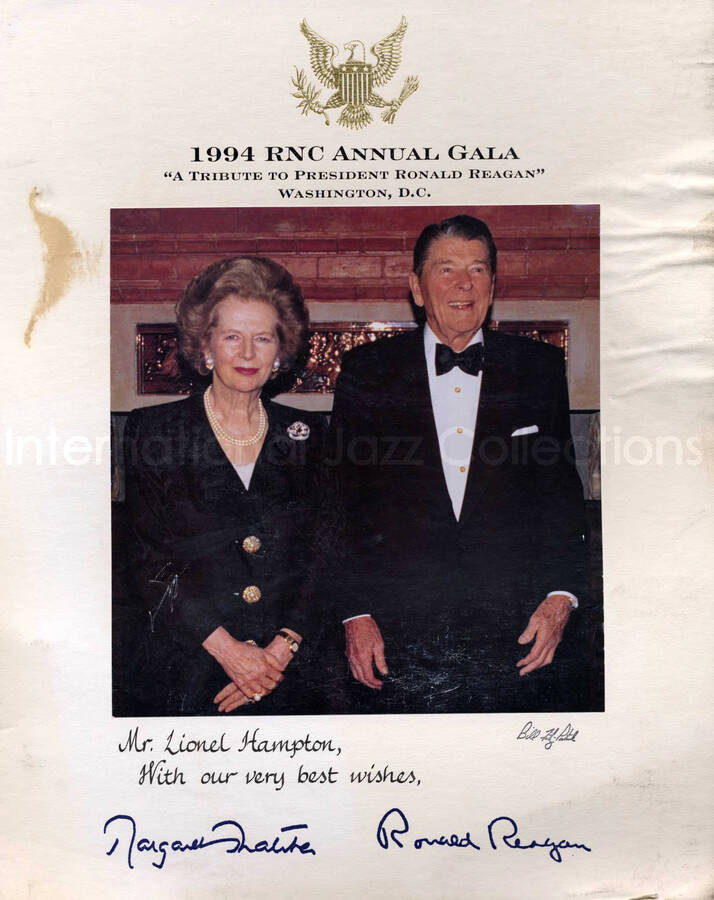 7 3/4 x 7 1/2 inch photograph. Margaret Thatcher and Ronald Reagan. This photograph is mounted on a 14 x 11 inch white board. Above the picture the board bears the gold coat of arms of the United States and the inscription: 1994 RNC Annual Gala; a tribute to President Ronal Reagan; Washington, D.C. This photograph is dedicated to Lionel Hampton and signed by the two