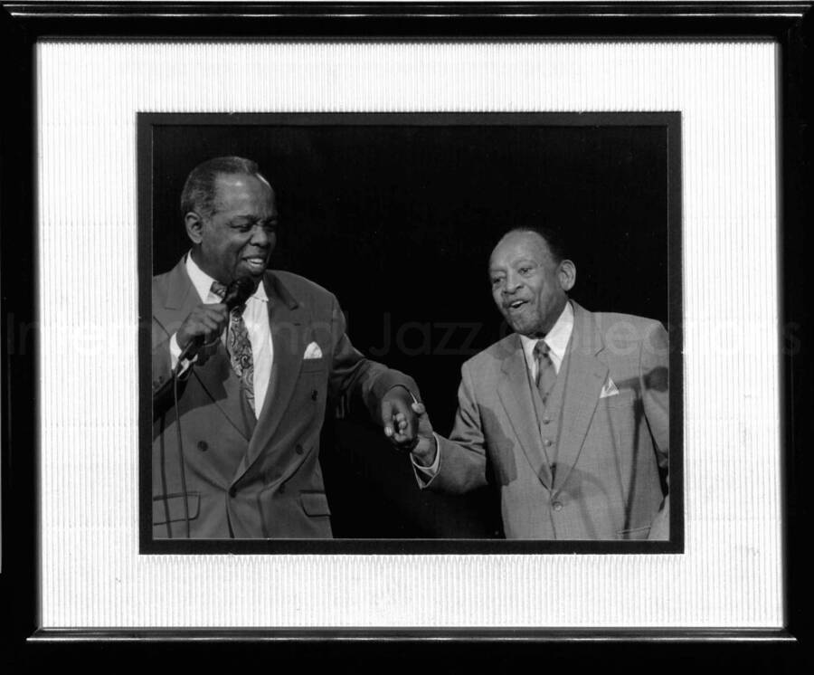 12 x 15 inch black frame holding a 10 x 8 inch black and white photograph. Lou Rawls and Lionel Hampton. Dedication on the back of the frame reads: To Lionel, Happy 90th Birthday and thanks for the memories. Love, Rose Neely, Moscow, Idaho