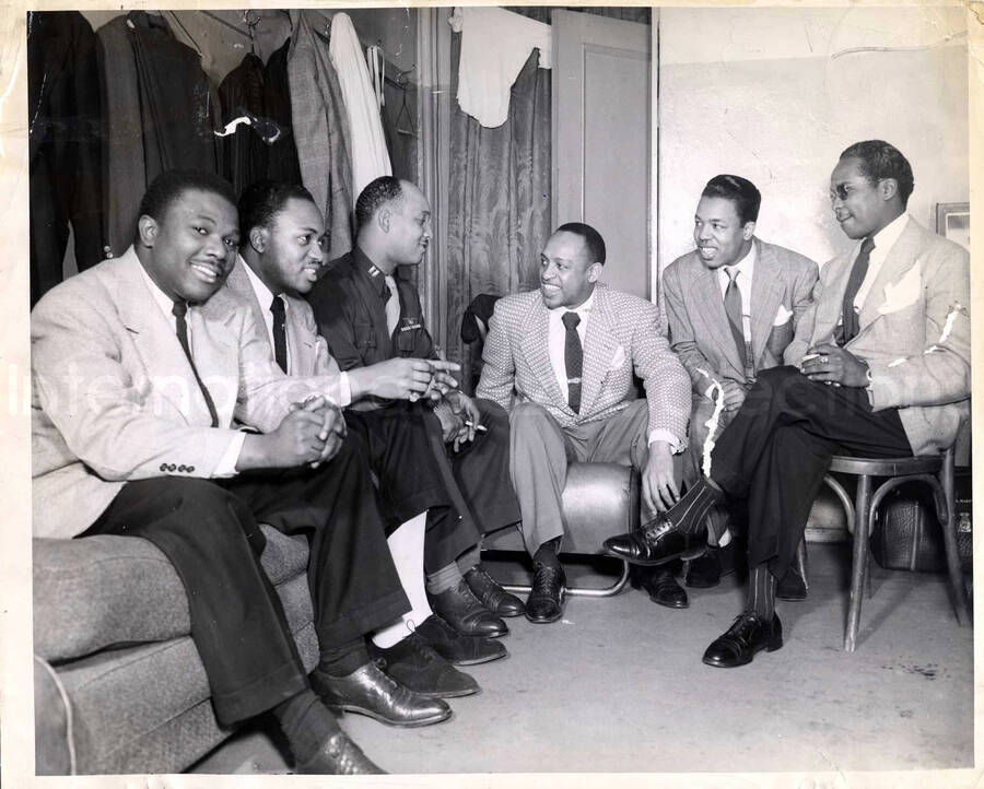 11 1/4 x 14 inch photograph. Lionel Hampton with unidentified men, including a US Air Force military