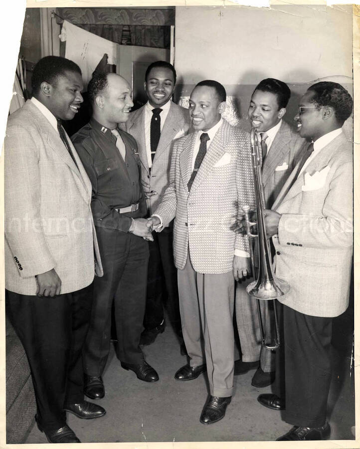 14 x 11 1/4 inch photograph. Lionel Hampton with unidentified men, including a US Air Force military