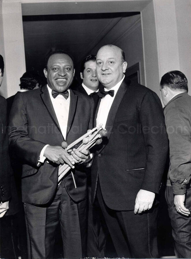 15 1/2 x 12 inch photograph. Lionel Hampton with unidentified man [in San Remo, Italy?]