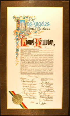 Certificate Plaque. 21 3/4"x11 3/4" Resolution with gold foil seal and green, yellow, and red ribbon laminated on a 25"x 15" wood plaque To Lionel Hampton from the City of Los Angeles for the honor of having his name placed in a star on Hollywood Boulevard Walk of Fame by the Hollywood Chamber of Commerce and other resolutions. Tom Bradley, Mayor and others. Los Angeles, CA, June 11, 1982.