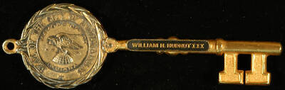 Key to the City. 2"x6" Gold metal cast key with the Seal of the City of Indianapolis on both sides of the bow and the mayor's name on one side of the stem Ceremonial key to the City of Indianapolis presented to Lionel Hampton. William H. Hudnut III, Mayor. Indianapolis, IN