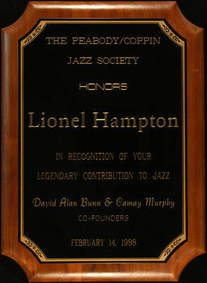 Plaque. 15"x11" Walnut finish plaque with engraved plate To Lionel Hampton from the Peabody/Coppin Jazz Society. David Alan Bunn and Camay Murphy, Co-founders. Baltimore, MD, Feb. 14, 1998