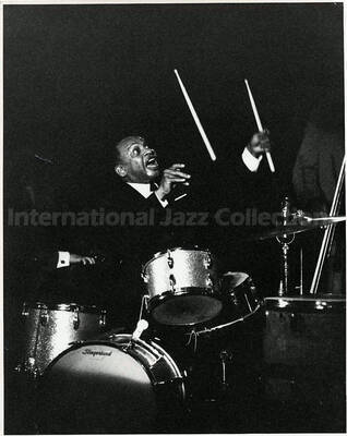 10 x 8 inch photograph. Lionel Hampton playing the drums