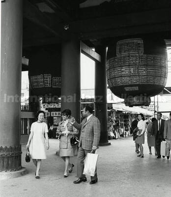 10 x 8 inch photograph. Gladys and Lionel Hampton in downtown Tokyo, Japan