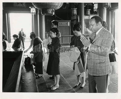 8 x 10 inch photograph. Gladys and Lionel Hampton in downtown Tokyo, Japan