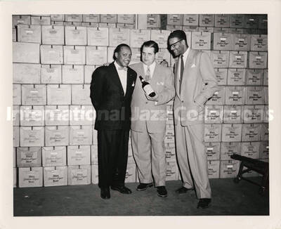 8 x 10 inch photograph. Lionel Hampton at the Altes Brewery. Handwritten on the back of the photograph: Lionel Hampton; Frank Colby, city sales manager; Frank M. Seymour, public relations director; Altes Brewing Co.