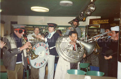 3 1/2 x 5 1/2 inch photograph. Lionel Hampton with the band Les Buccinateurs Reunis in a restaurant in [Bordeaux], France