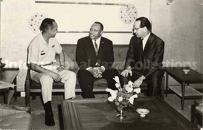 3 1/2 x 5 1/2 inch photograph. Lionel Hampton with unidentified men