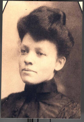 6 x 4 inch photograph. Portrait of a woman. Handwritten on the back of the photograph: Lionel Hampton's Grandmother, Mama Louvenia. This photograph is dedicated to Lionel Hampton from Chip Deffaa, 1997-03-08. This picture was in a Promart frame