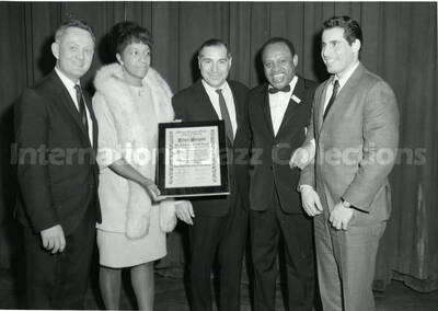 5 x 7 inch photograph. Lionel Hampton receives the Honorary Lifetime Member of the Faculty from the Harlem Hospital Center School of Nursing, at the New York City's Town Hall. New York, NY