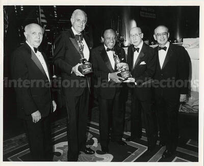 8 x 10 inch photograph. Lionel Hampton with unidentified men on the occasion of his receiving the Lifetime Achievement Award of B'nai B'rith, at the Sheraton Centre in New York