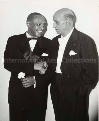 10 x 8 inch photograph. Lionel Hampton with Dimitri Mitropoulos. Handwritten on the back of the photograph: W. Dimitri Mitropolis, King David Suite