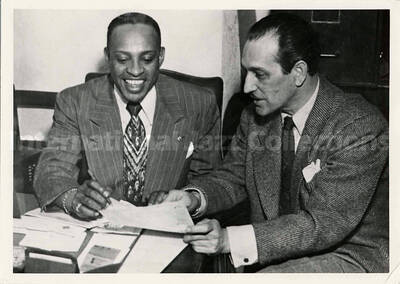 5 x 7 inch photograph. Lionel Hampton with unidentified man