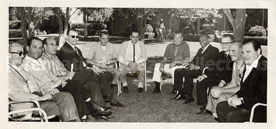 3 1/2 x 7 1/4 inch photograph. Lionel Hampton with a group of unidentified men