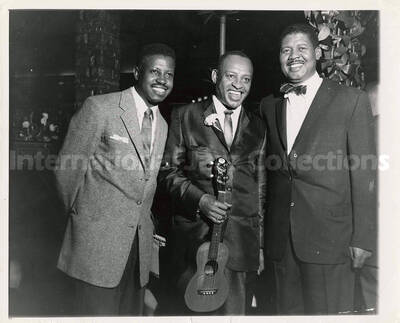 8 x 10 inch photograph. Lionel Hampton with two unidentified men