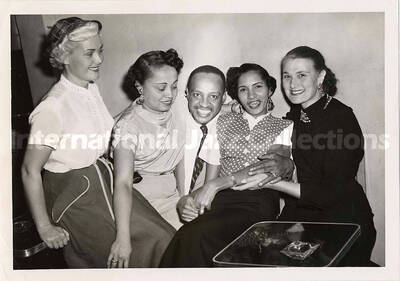5 x 7 inch photograph. Lionel Hampton with unidentified women