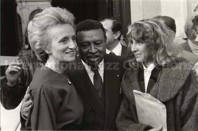 6 1/2 x 9 1/2 inch photograph.  Lionel Hampton with two unidentified women on the occasion of his receiving the medal of the City of Paris