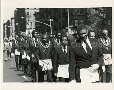 8 x 10 inch photograph. Medina Temple N. 19 Foot Patrol parades on the occasion of the Grand Opening of Lionel Hampton Houses in New York, NY
