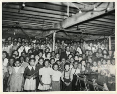 8 x 10 inch photograph. Lionel Hampton surrounded by several children and two catholic nuns