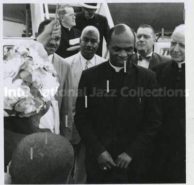3 1/2 x 3 1/2 inch photograph. Unidentified religious man [at the 48th Annual Convention Knights and Ladies of St. Peter Claver?]