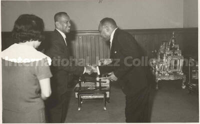 3 1/2 x 5 1/2 inch photograph. Lionel Hampton with Pol. Col Luen Krisanamara Asst. Lord Mayor of Bangkok (Thailand) and City Clerk Mrs. Nandaka Wattanakorn