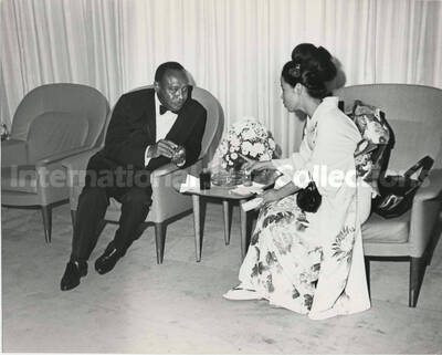 7 1/2 x 9 1/2 inch photograph. Lionel Hampton with unidentified woman dressed in Japanese costume [Yukari Kuroda?]