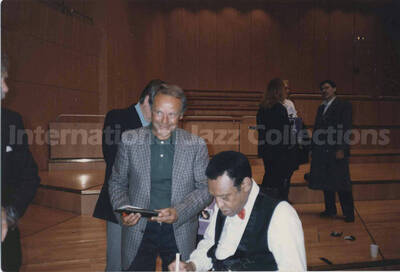 4 x 6 inch photograph. Lionel Hampton signs autograph