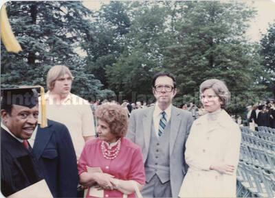 3 1/2 x 5 inch photograph. Lionel Hampton in graduation garb with unidentified persons [on the occasion of his receiving a honorary degree from a university?]