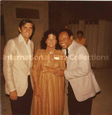 3 1/2 x 3 1/2 inch photograph. Lionel Hampton with unidentified man and woman