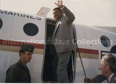3 1/2 x 5 inch photograph. Lionel Hampton boarding a US Marines airplane