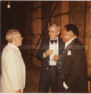 3 1/2 x 3 1/2 inch photograph. Lionel Hampton with unidentified men