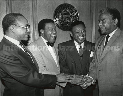 8 x 10 inch photograph. Publisher John Sengstacke, Judge Russell R. DeBow, Lionel Hampton, and Chicago City Mayor Harold Washington