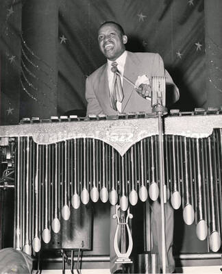 10 x 8 inch photograph. Lionel Hampton playing the Deagan vibraphone