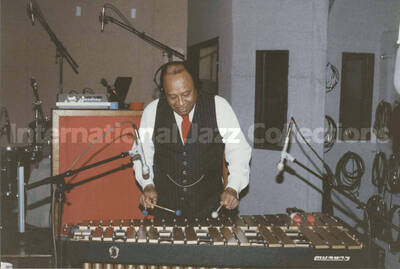 4 x 6 inch photograph. Lionel Hampton recording with Sylvia Bennett