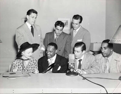 8 x 10 inch photograph. Lionel Hampton with five unidentified men and a woman at the NBC studio