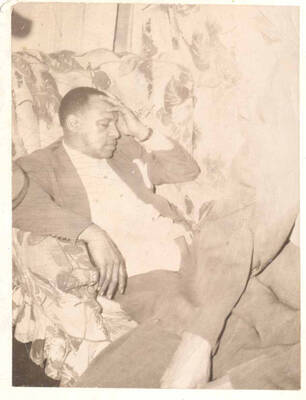 4 x 3 inch photograph. Lionel Hampton resting on a chair