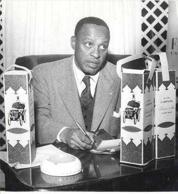 9 1/2 x 7 inch photograph. Lionel Hampton poses for Carpano vermouth, in Italy