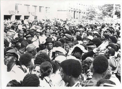 8 x 10 inch photograph. Members of the Medina Temple among crowd at the Grand Opening of Lionel Hampton Houses