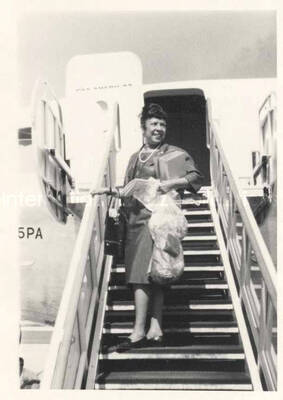 4 1/2 x 3 1/4 inch photograph. Gladys Hampton outside a plane of the Pan American airlines