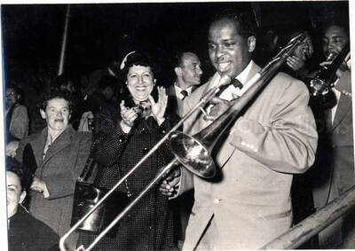 4 1/2 x 6 inch photograph. Lionel Hampton performing with band in Israel. Unidentified trombonist