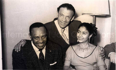 5 x 8 inch photograph. Lionel Hampton with unidentified persons in a restaurant in Israel