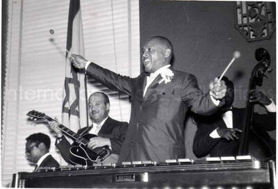 4 x 5 1/2 inch photograph. Lionel Hampton on vibraphone with band, which includes guitarist Billy Mackel, at the Youth Aliyah conference, Israel