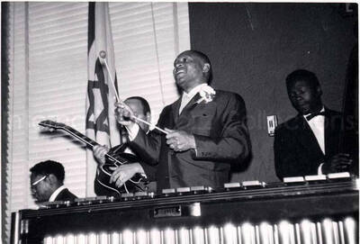 4 x 5 1/2 inch photograph. Lionel Hampton on vibraphone with band, which includes guitarist Billy Mackel, at the Youth Aliyah conference, Israel
