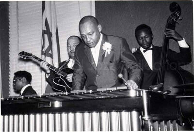 4 x 5 1/2 inch photograph. Lionel Hampton on vibraphone with band, which includes guitarist Billy Mackel, at the Youth Aliyah conference, Israel