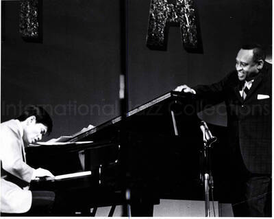 8 x 10 inch photograph. Lionel Hampton with unidentified pianist [in Japan?]