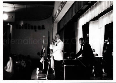 4 3/4 x 6 1/2 inch photograph. Lionel Hampton on stage with Bob Hope