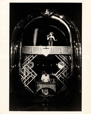 10 x 8 inch photograph. Lionel Hampton with Bette Midler at the Minskoff Theater. Handwritten on the back of the photograph: Clams on the Half Shell; first Broadway Show