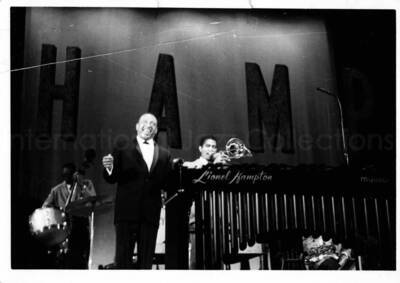 3 1/2 x 5 inch photograph. Lionel Hampton with orchestra [in Japan?]